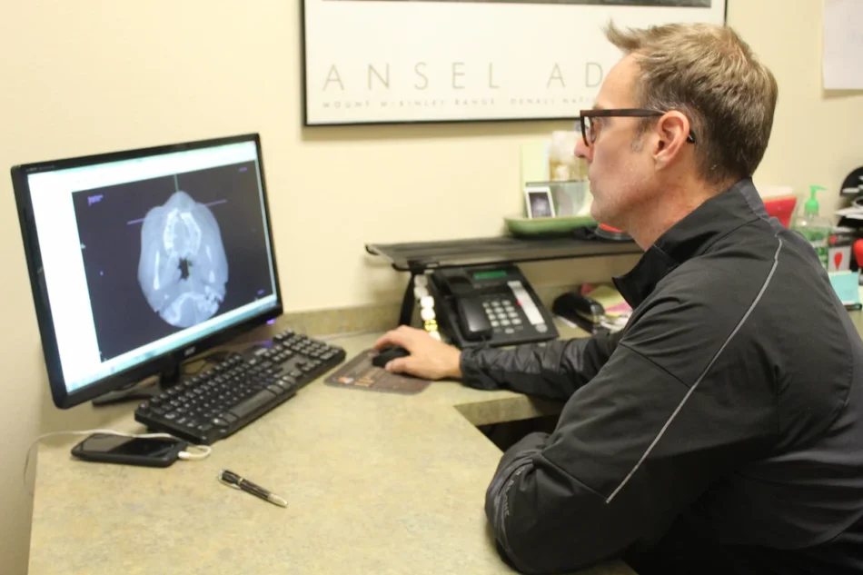 Dr. Draper assessing a client's needs through modern technology