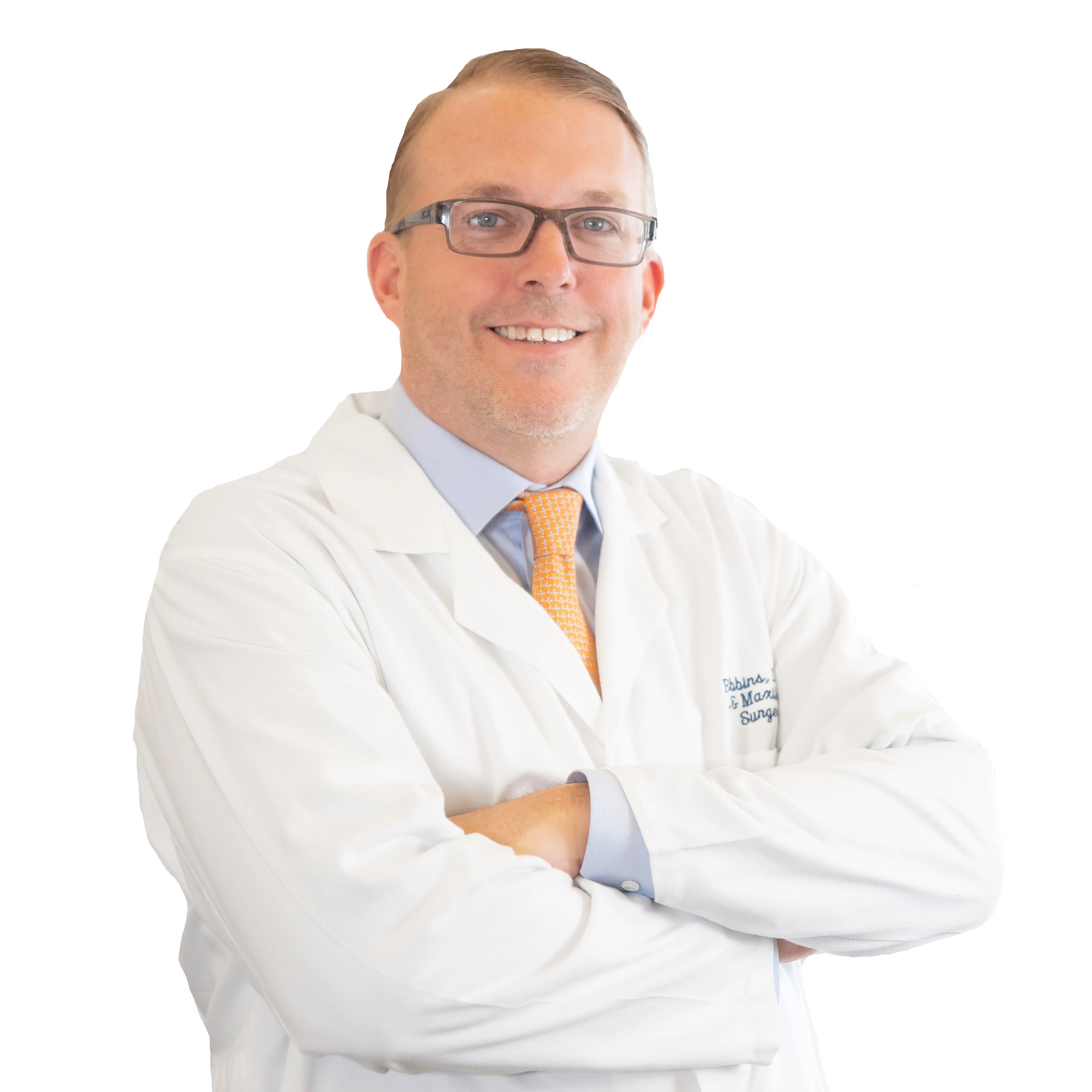 Image of Dr. Reed Gibbins, wearing a warm smile, reflecting his friendly and welcoming demeanor.