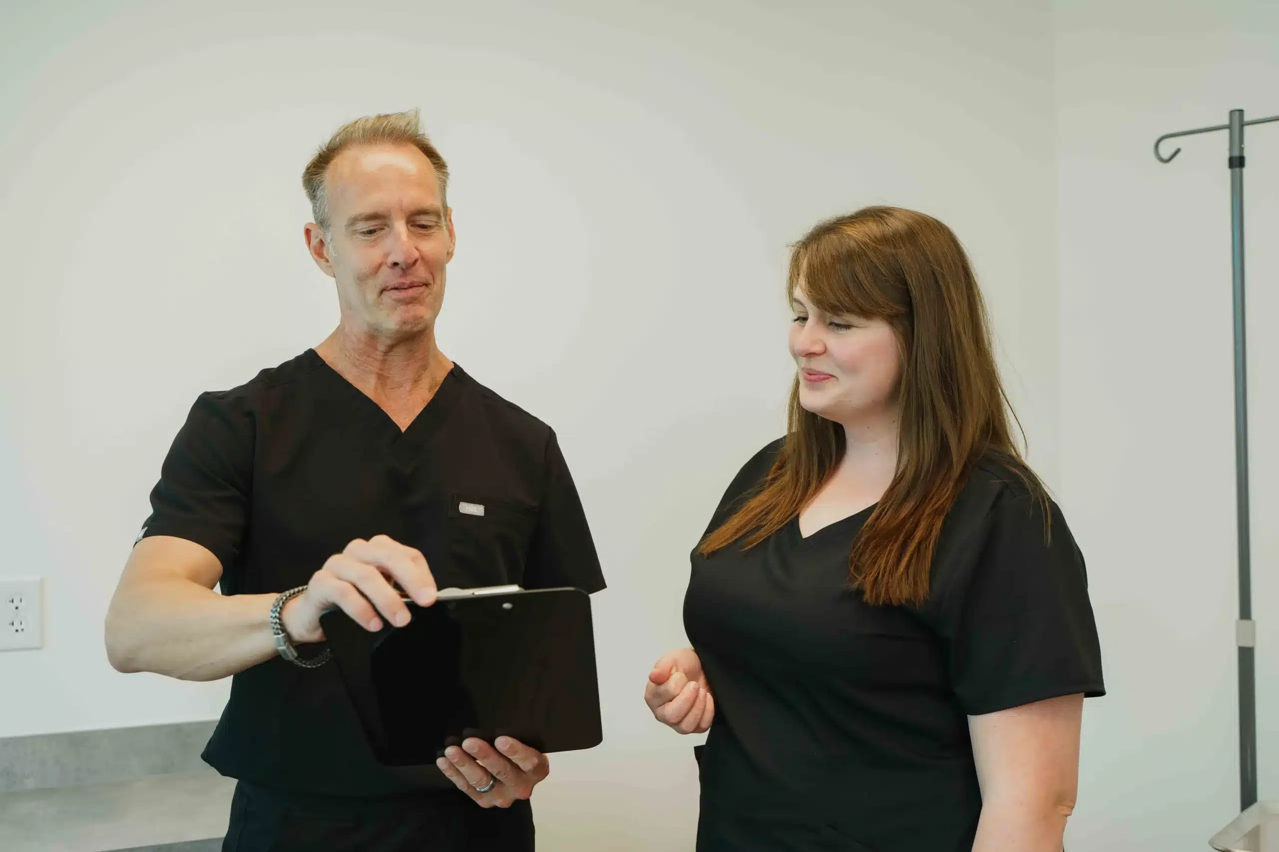 Dr. Draper explaining treatment to a patient