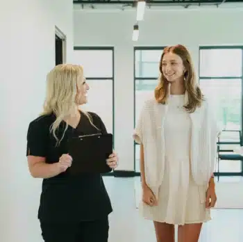 Dental assistant explaining about sinus lift to a patient 